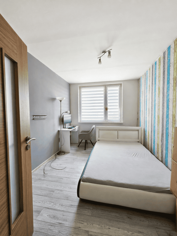 Minimalist bedroom with office space.png